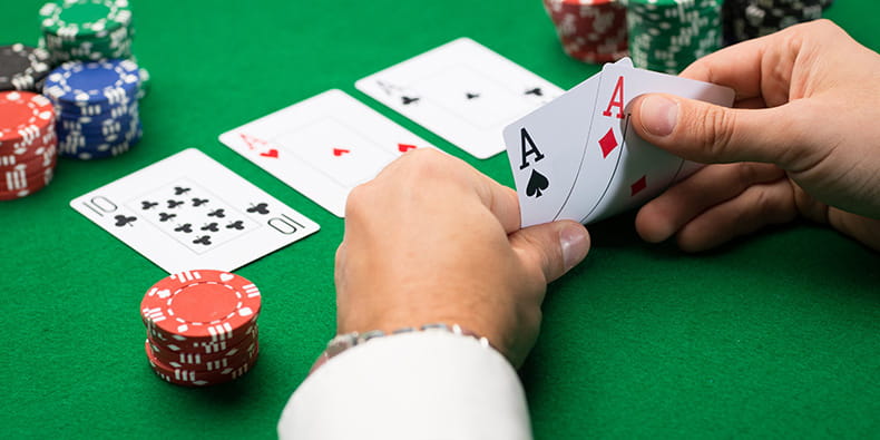 Man Playing Poker on Casino Table