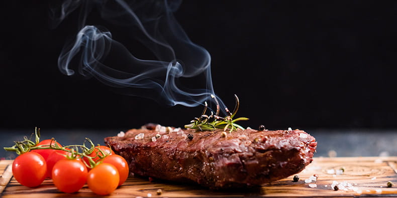 Cut Steak on a Cutting Board