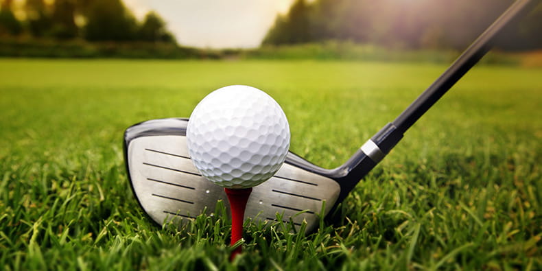 Golf Ball in Front of a HoleGolf Ball in Front of a Hole